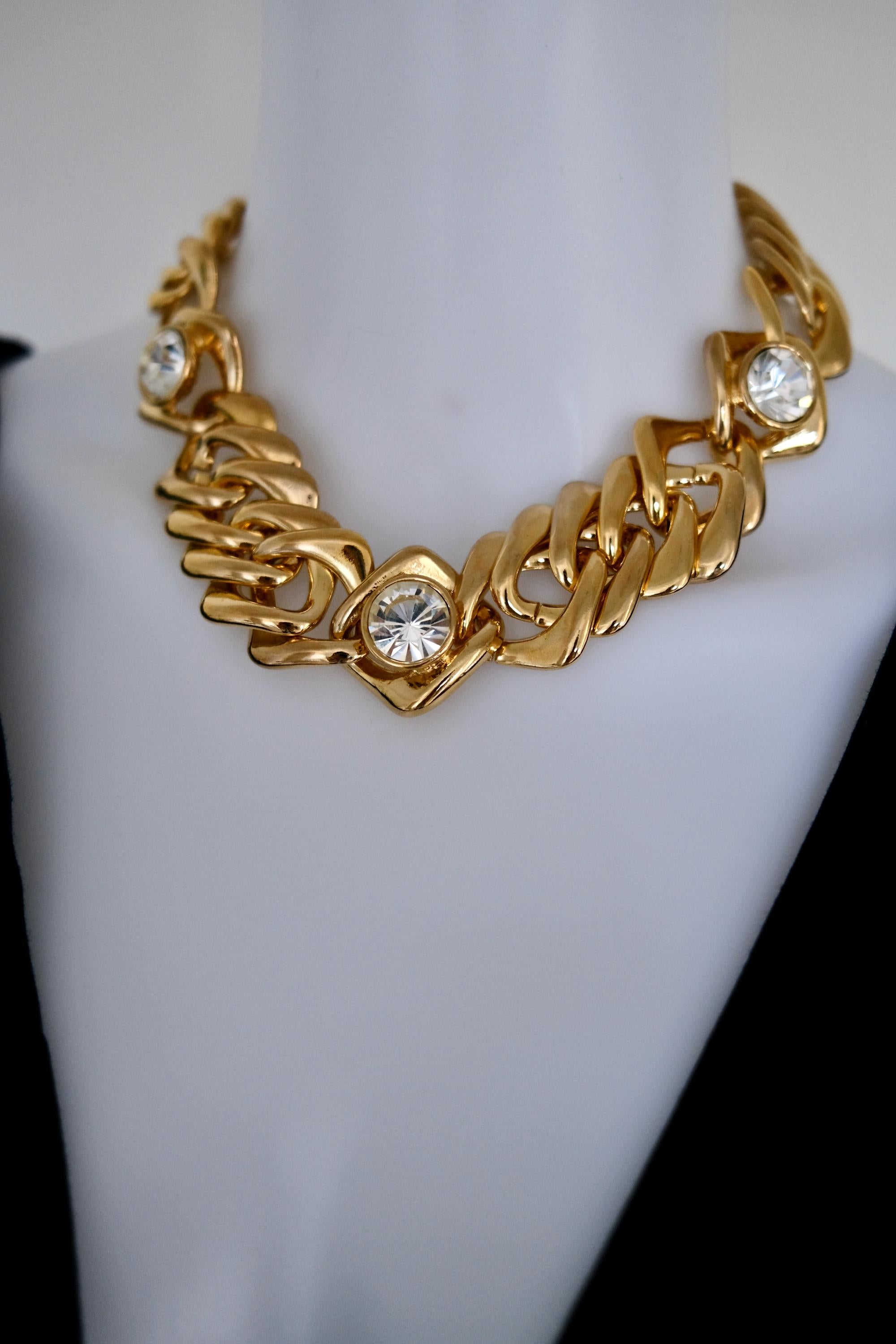 Vintage YSL gold-tone crystal choker necklace styled with an elegant evening dress