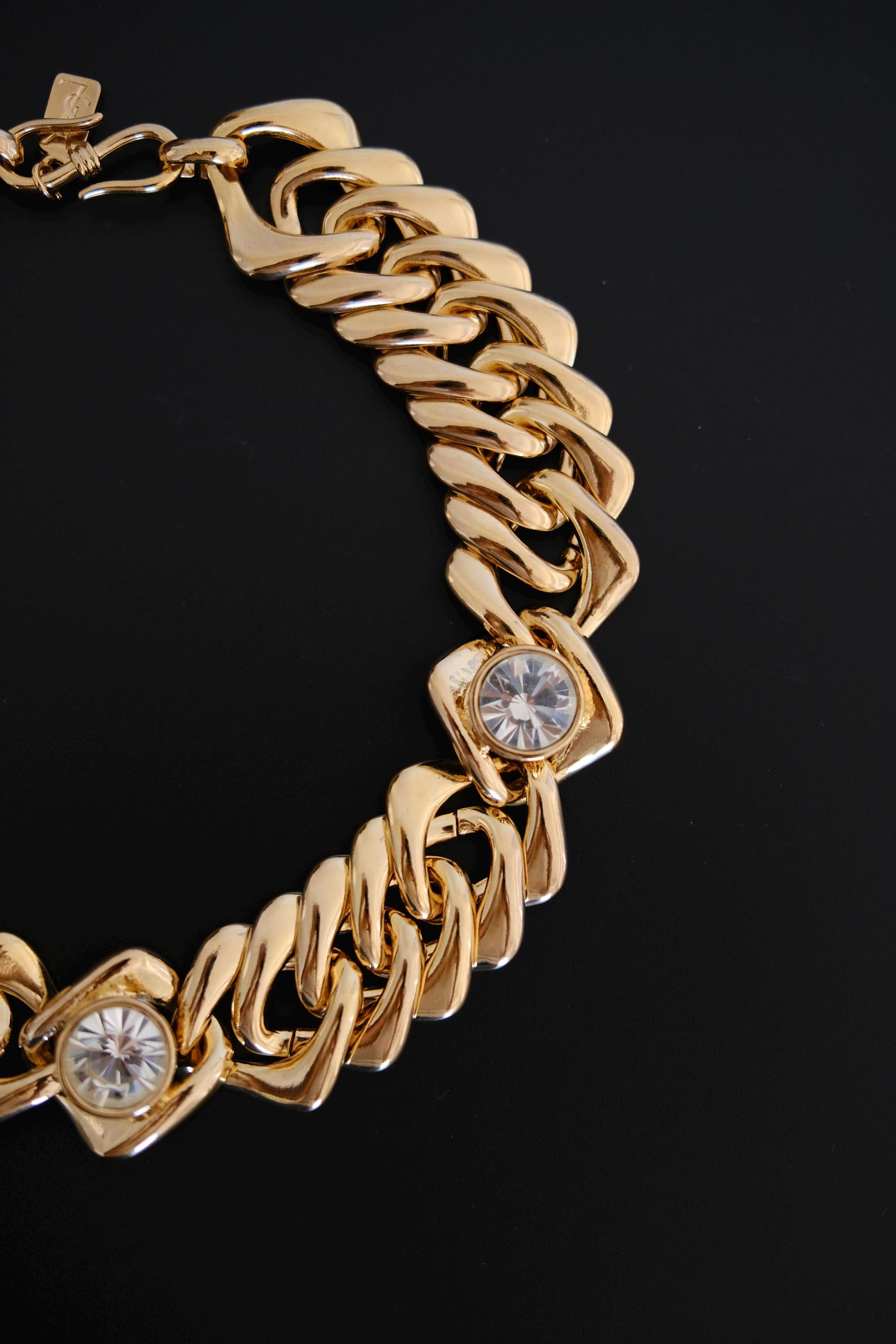Detailed view of sculptural interlocking gold-tone chain links on vintage Yves Saint Laurent necklace