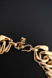 YSL signed designer tag on vintage Yves Saint Laurent gold-tone crystal necklace