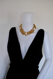 Vintage Yves Saint Laurent chunky gold chain crystal statement choker worn around the neckline