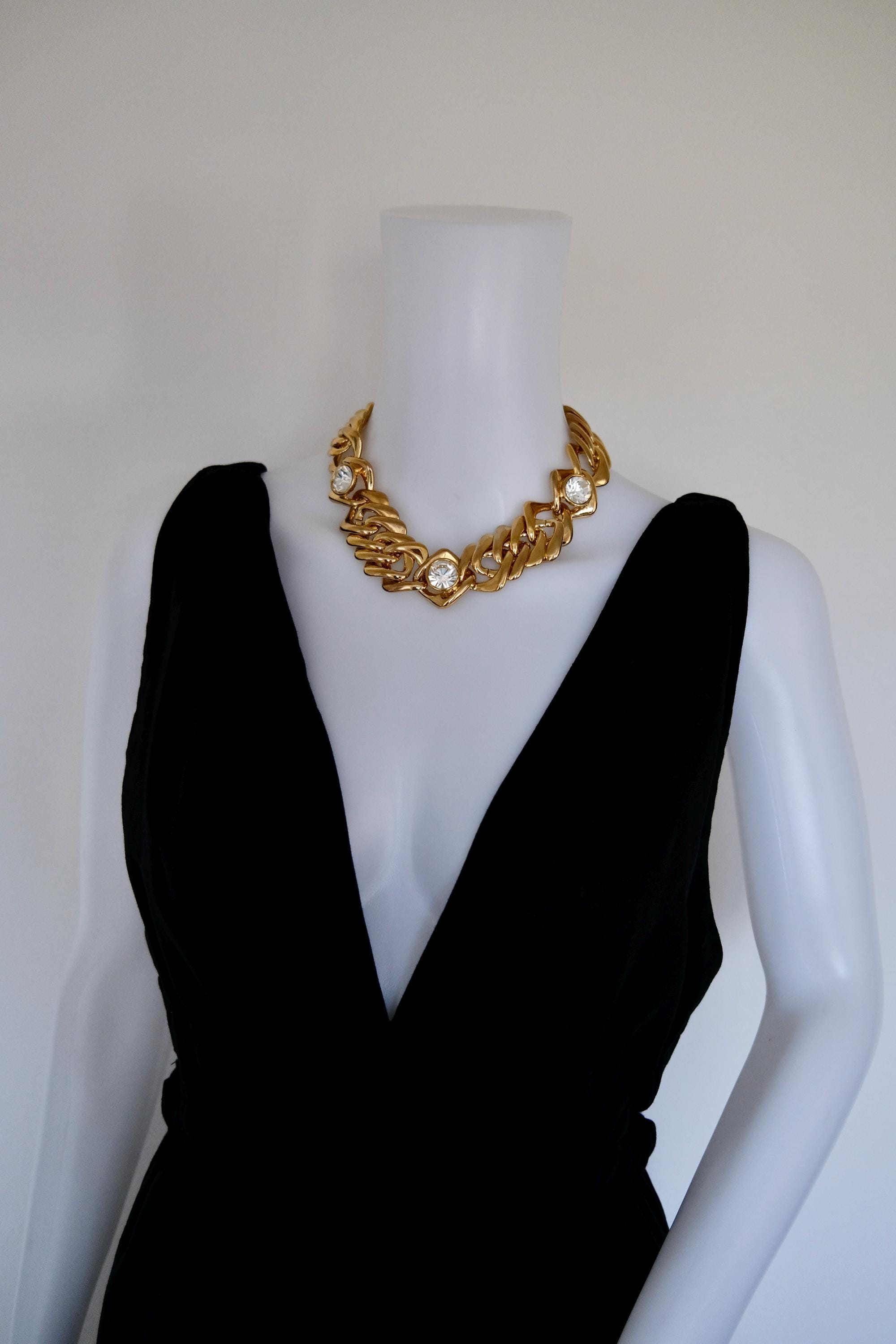 Vintage Yves Saint Laurent chunky gold chain crystal statement choker worn around the neckline