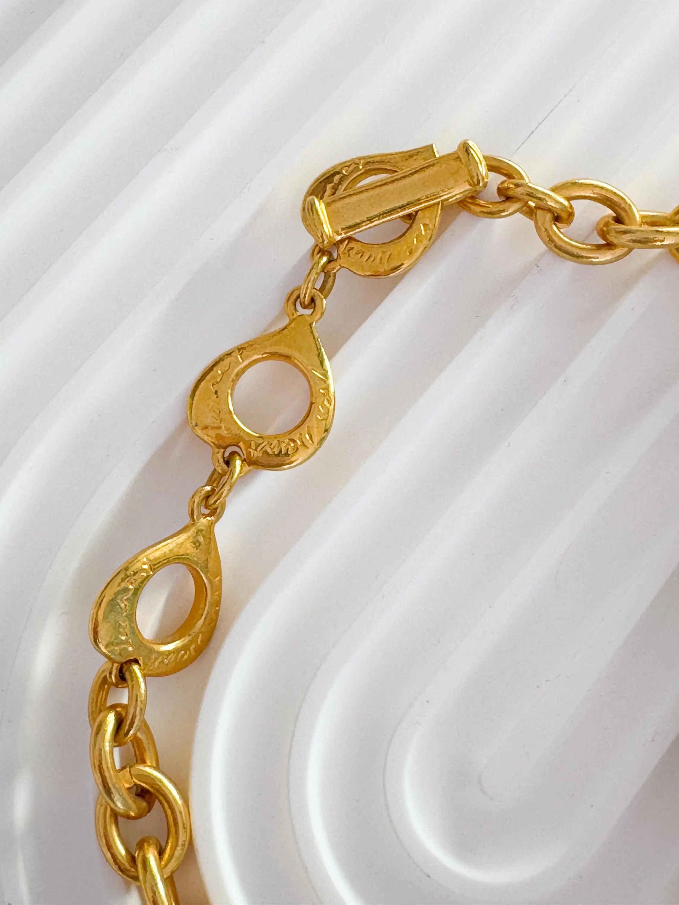 Vintage Yves Saint Laurent Necklace – YSL Gold-Tone Openwork Floral Pendant with Toggle Clasp – 1980s Designer Jewelry – Rare Gift for Her