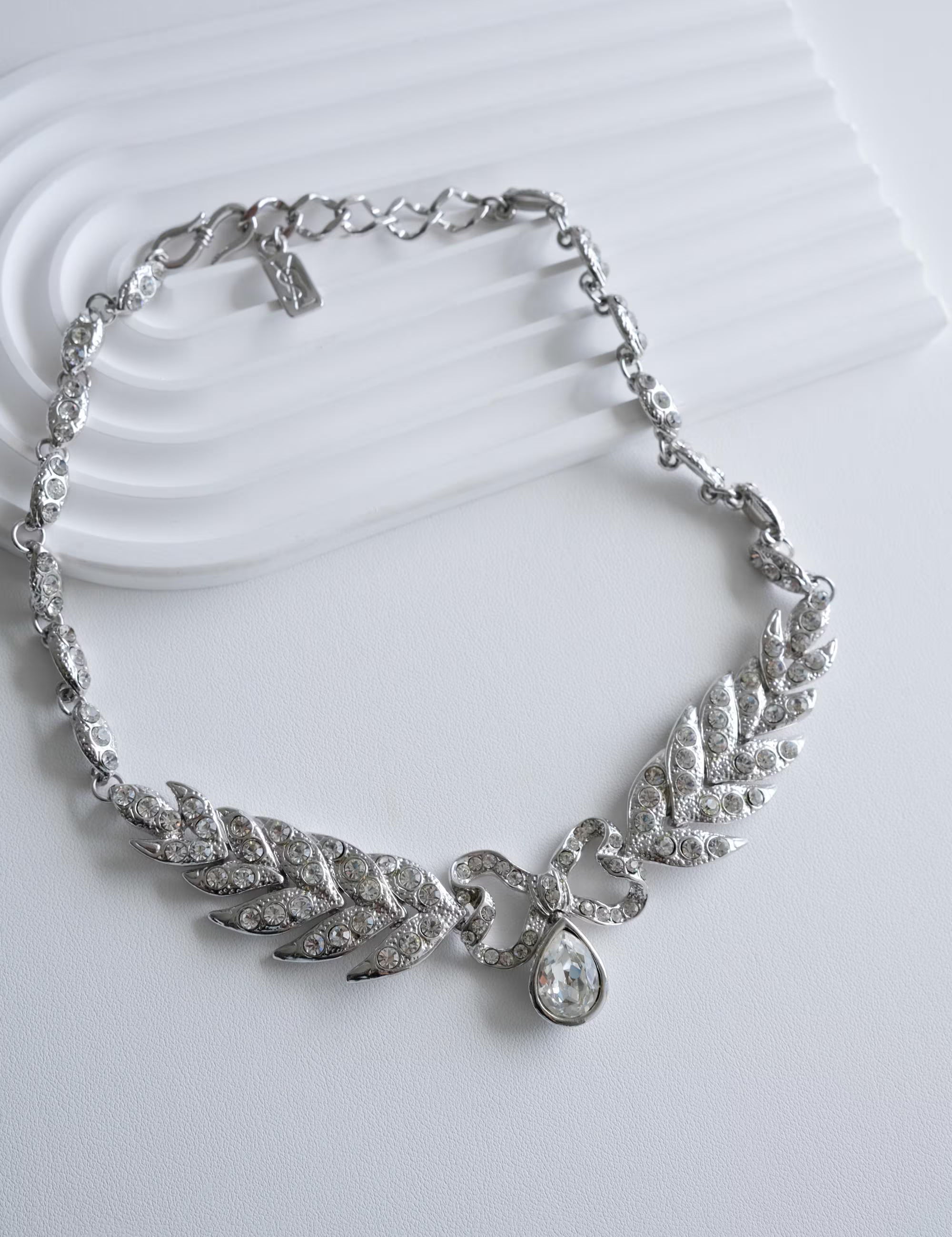 Elegant vintage Yves Saint Laurent YSL silver bow rhinestone choker romantic luxury jewelry