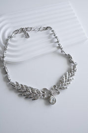 Elegant vintage Yves Saint Laurent YSL silver bow rhinestone choker romantic luxury jewelry
