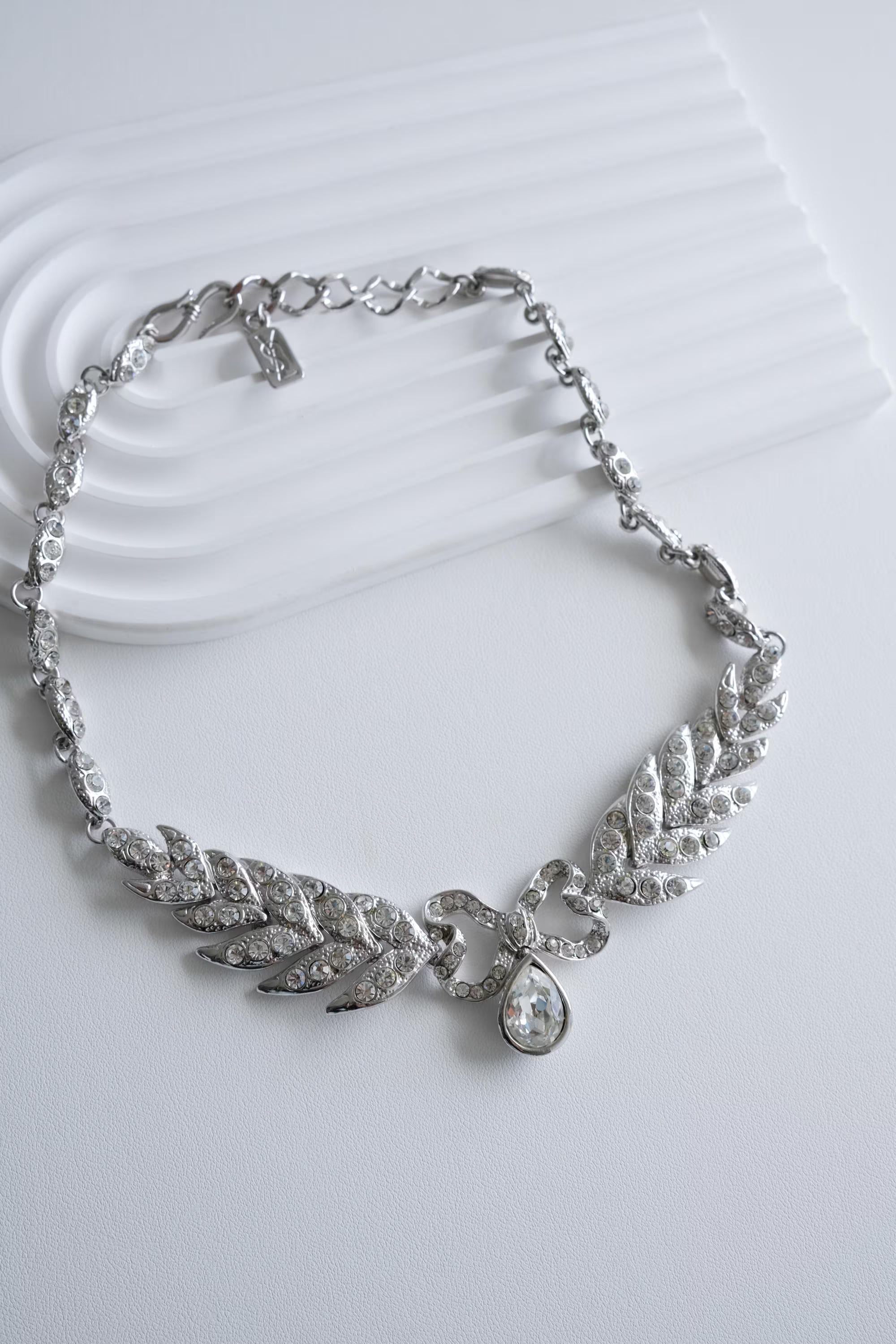 Elegant vintage Yves Saint Laurent YSL silver bow rhinestone choker romantic luxury jewelry