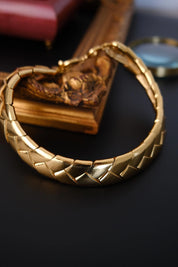 Vintage Yves Saint Laurent YSL gold tone wheat link choker necklace with sculptural articulated design, made in France