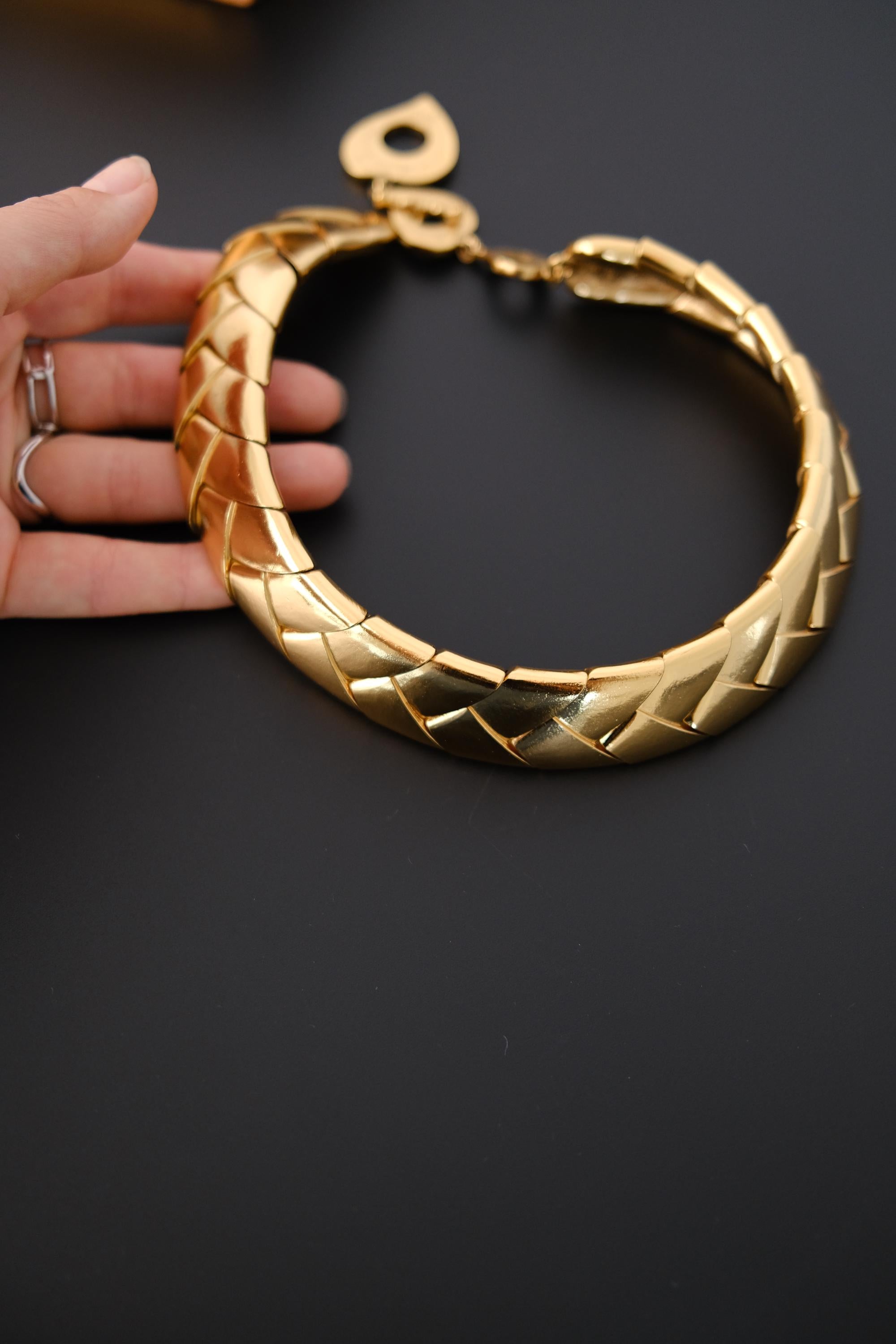 Vintage Yves Saint Laurent gold choker necklace measuring approximately 45 cm long with 2.5 cm maximum width