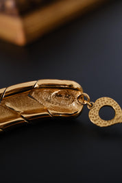Made in France and YSL stamp details on authentic vintage Yves Saint Laurent gold tone necklace