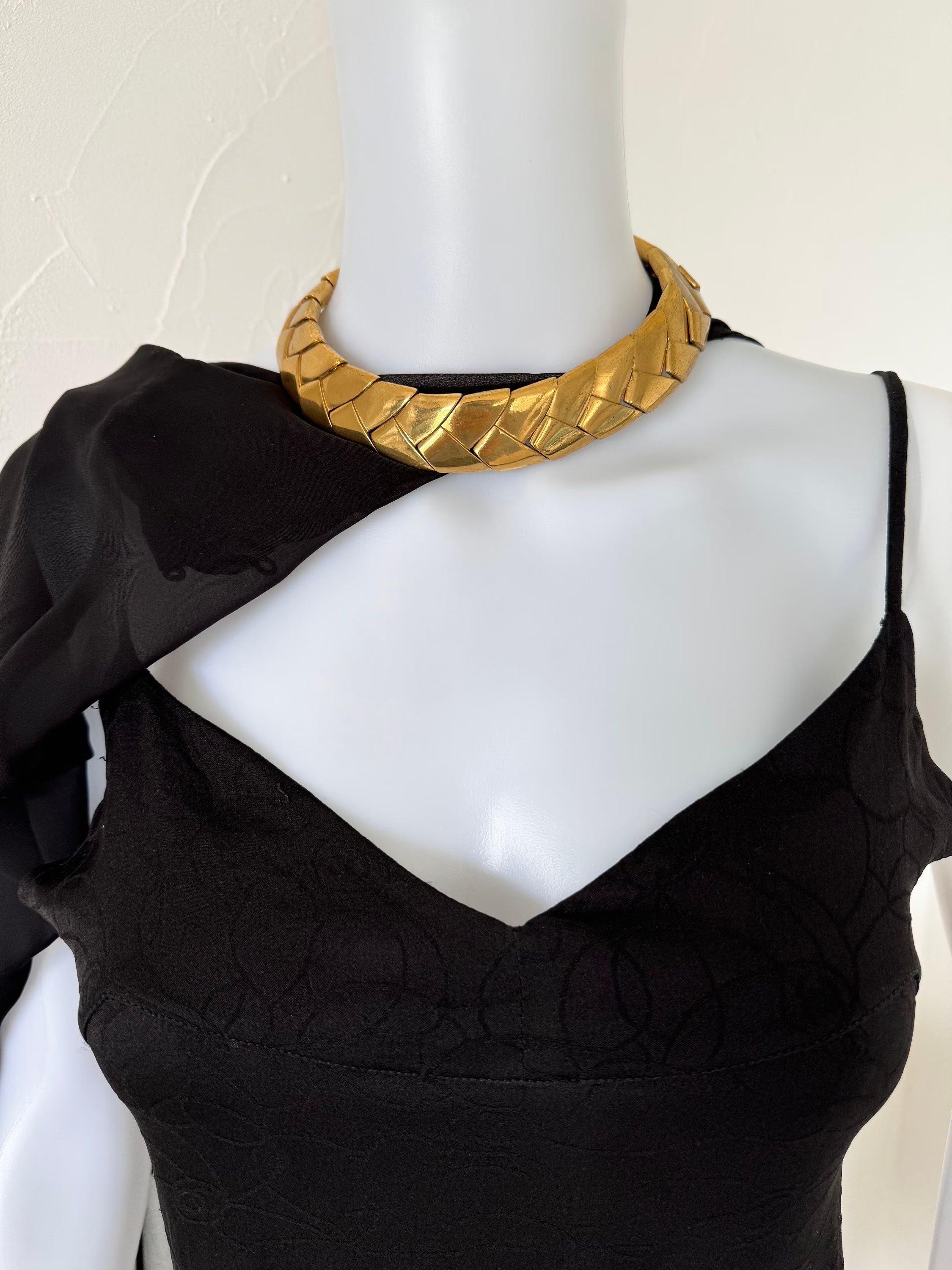 Yves Saint Laurent vintage gold tone wheat link collar necklace styled with an elegant black dress