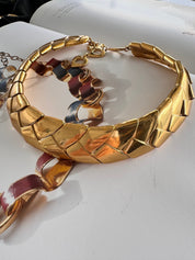Excellent vintage condition Yves Saint Laurent gold tone necklace showing bright polished finish and articulated wheat style links
