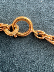 Close-up of Vintage Chanel CC crystal pendant necklace gold plated