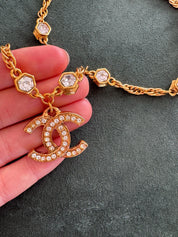 Close-up of Vintage Chanel CC crystal pendant necklace gold plated