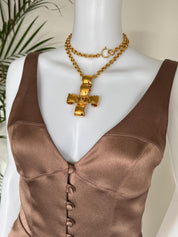 Vintage Chanel 1994 CC cross necklace worn as iconic statement jewelry