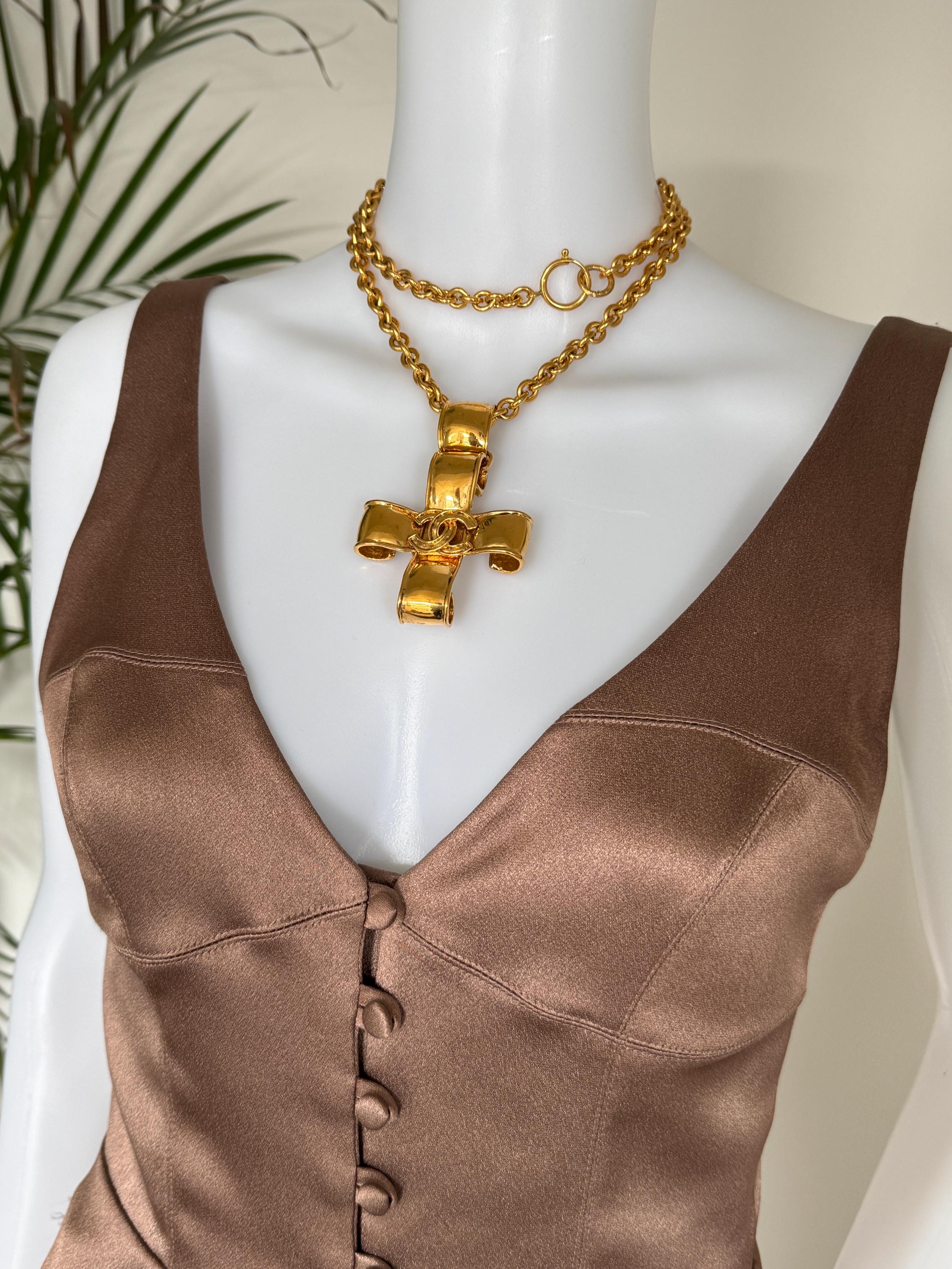 Vintage Chanel 1994 CC cross necklace worn as iconic statement jewelry