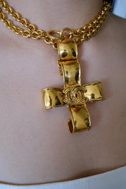 intage Chanel 1994 CC cross necklace worn as iconic statement jewelry