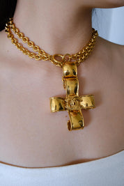 Vintage Chanel 1994 CC cross necklace worn as iconic statement jewelry