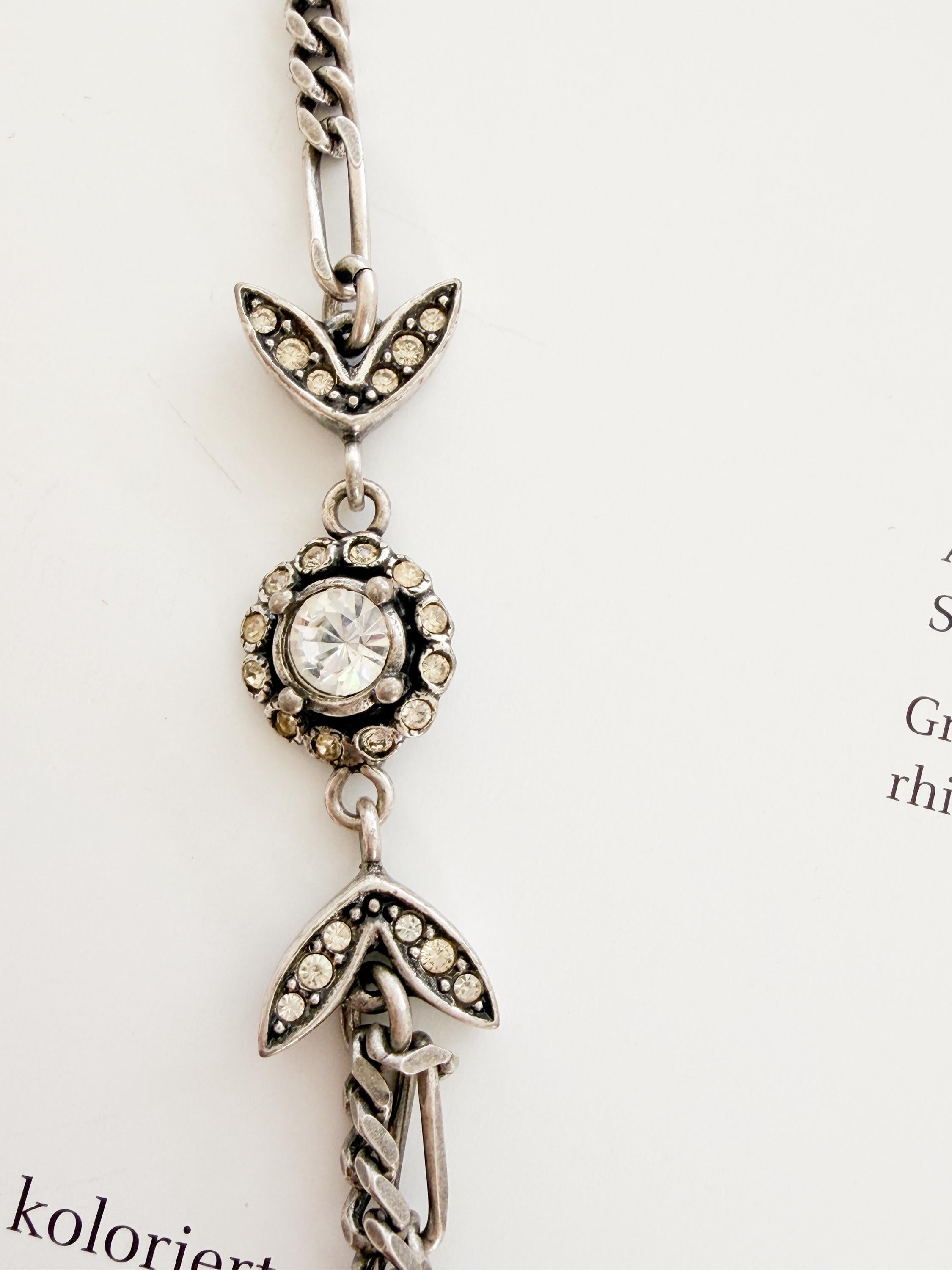 Close-up of sparkling crystal detail on vintage Christian Dior choker necklace
