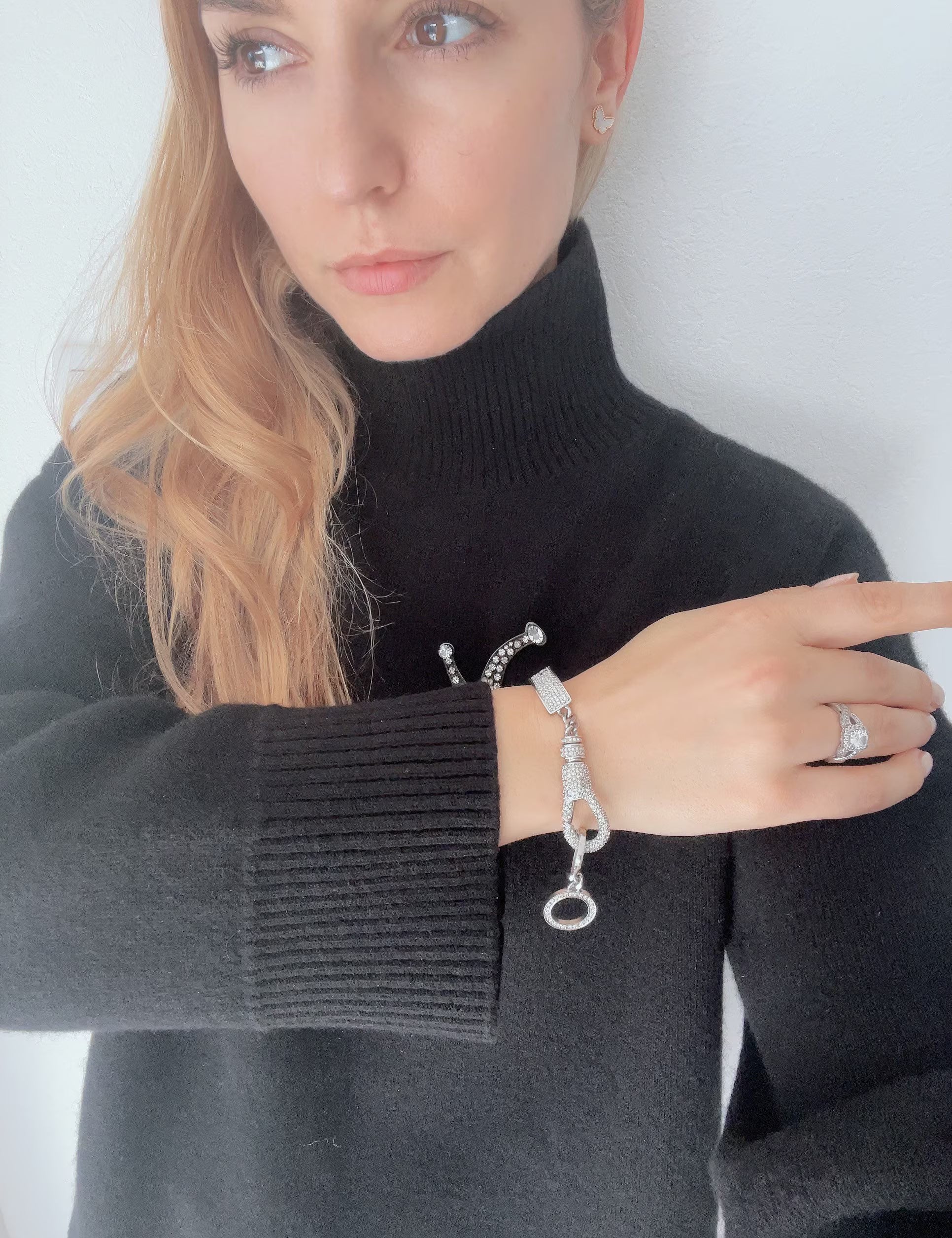 Vintage Christian Dior rhinestone charm bracelet worn as statement jewelry