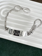 Vintage Christian Dior silver tone rhinestone charm bracelet elegant designer jewelry