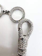 Close-up of Vintage Christian Dior rhinestone charm bracelet silver tone
