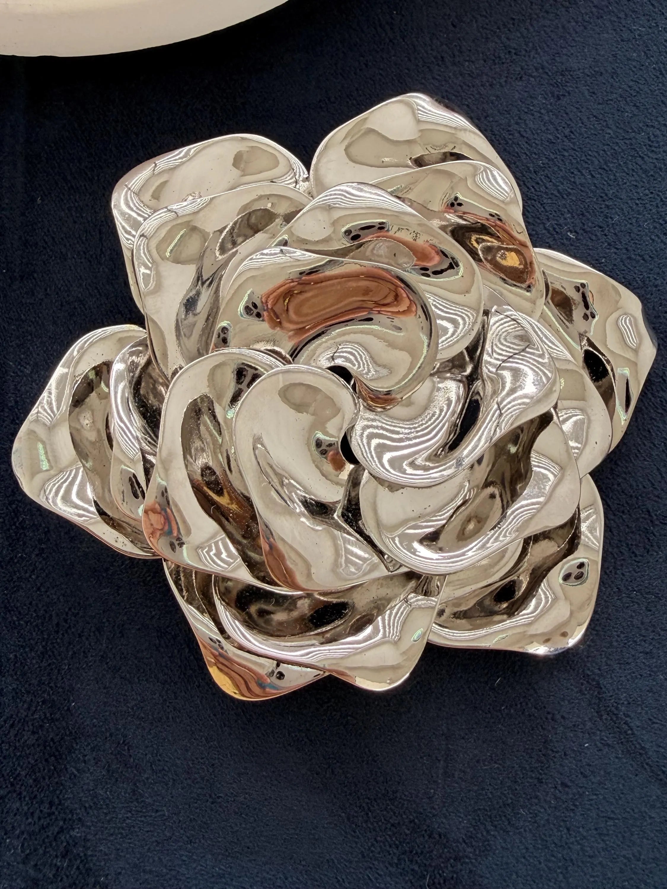 Vintage Dior sculptural rose brooch with mirror-like silver tone surface
