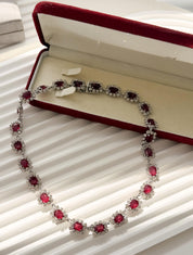 Vintage Dior necklace with luminous ruby crystals and refined silver tone setting