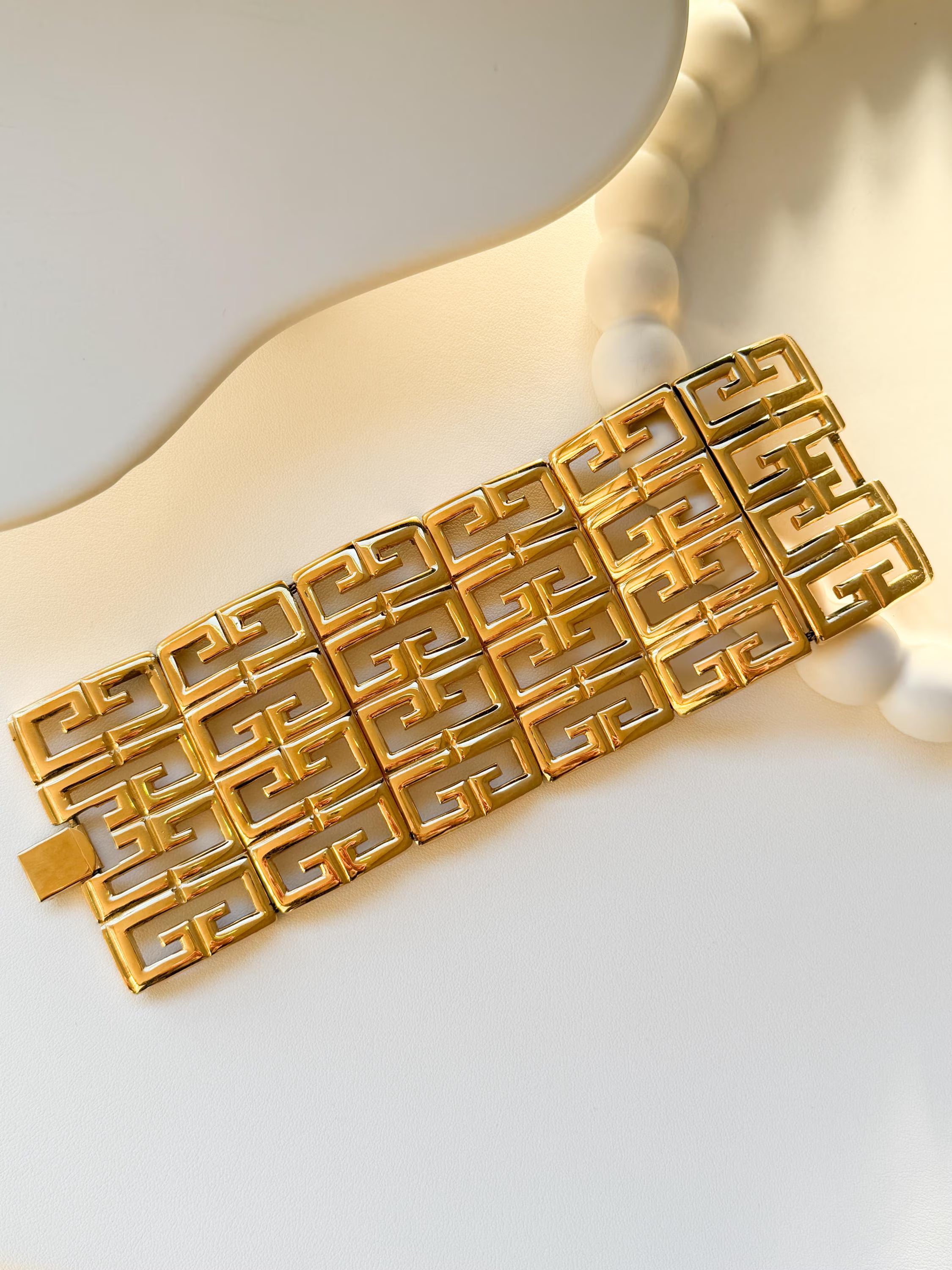 Vintage Givenchy gold tone chunky bracelet with iconic G logo monogram