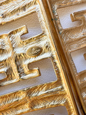 Close-up of Vintage Givenchy G logo monogram bracelet in gold tone