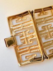 Side view of Vintage Givenchy chunky gold tone monogram bracelet