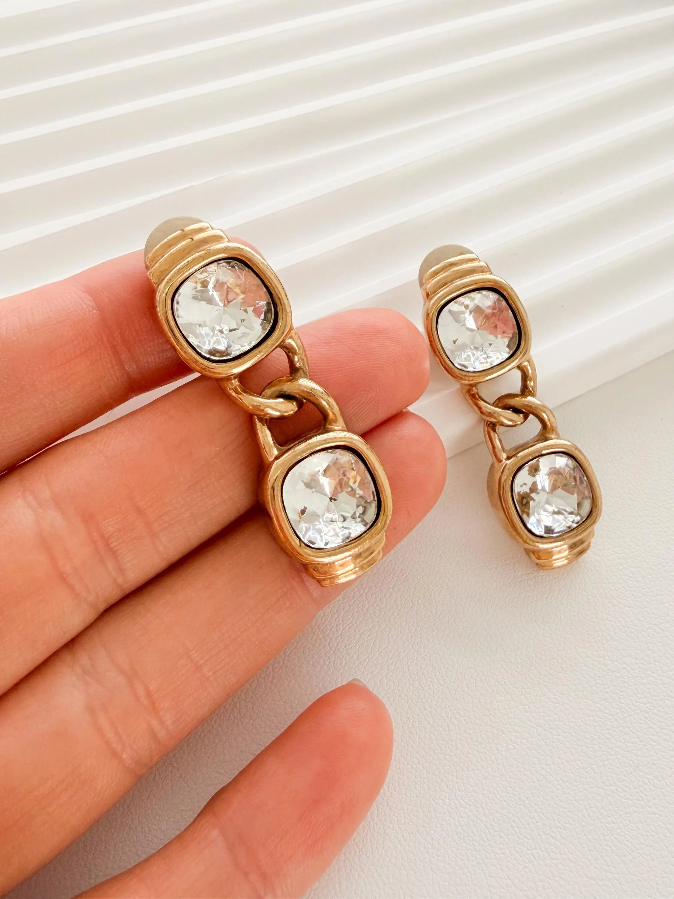 Vintage Givenchy crystal earrings worn as luxury statement piece