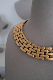 Close-up of Vintage Givenchy gold plated articulated link choker necklace