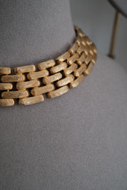 Close-up of Vintage Givenchy gold plated articulated link choker necklace