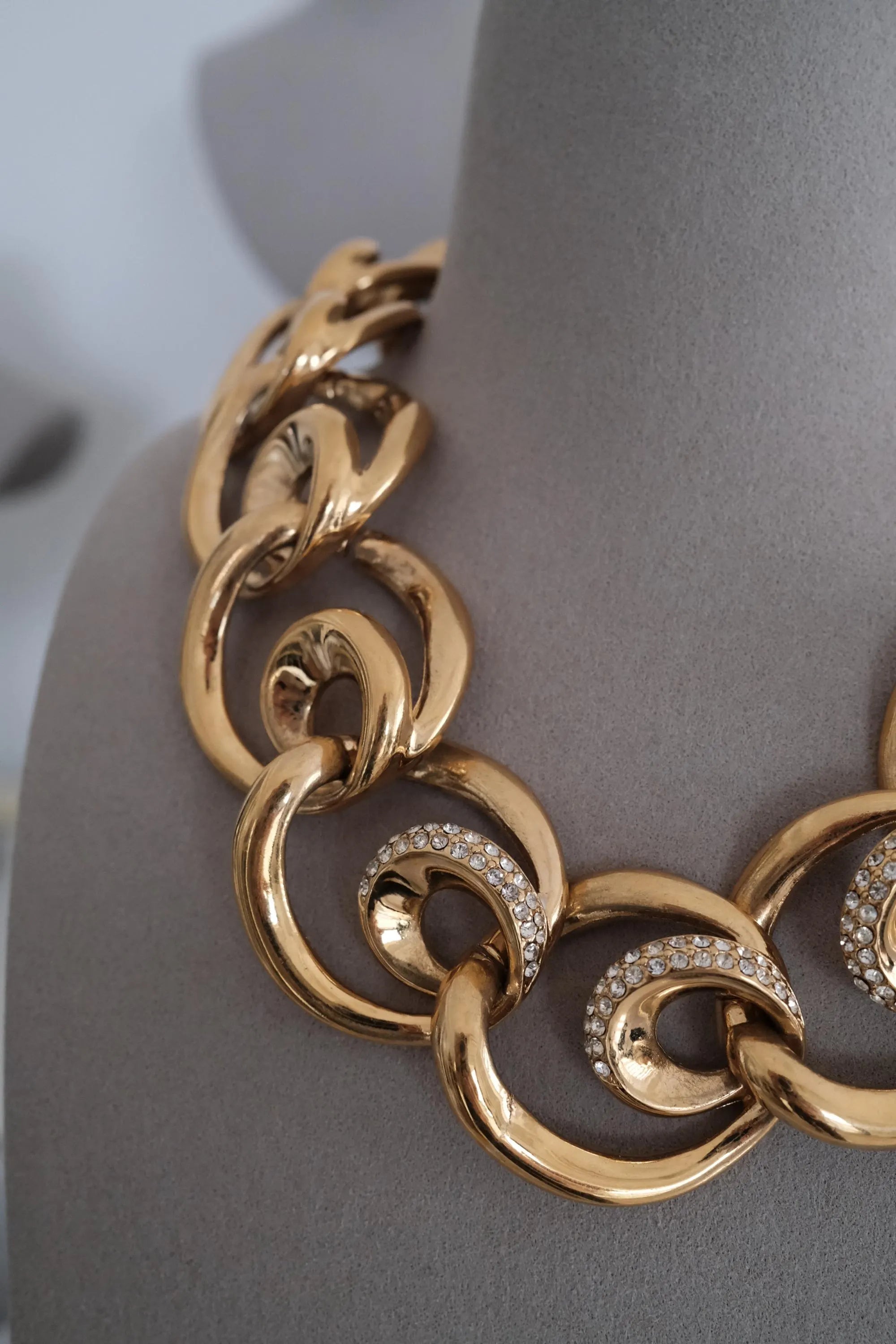 Close-up of Vintage Givenchy gold plated crystal ring link necklace