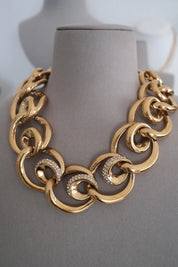 Close-up of Vintage Givenchy gold plated crystal ring link necklace