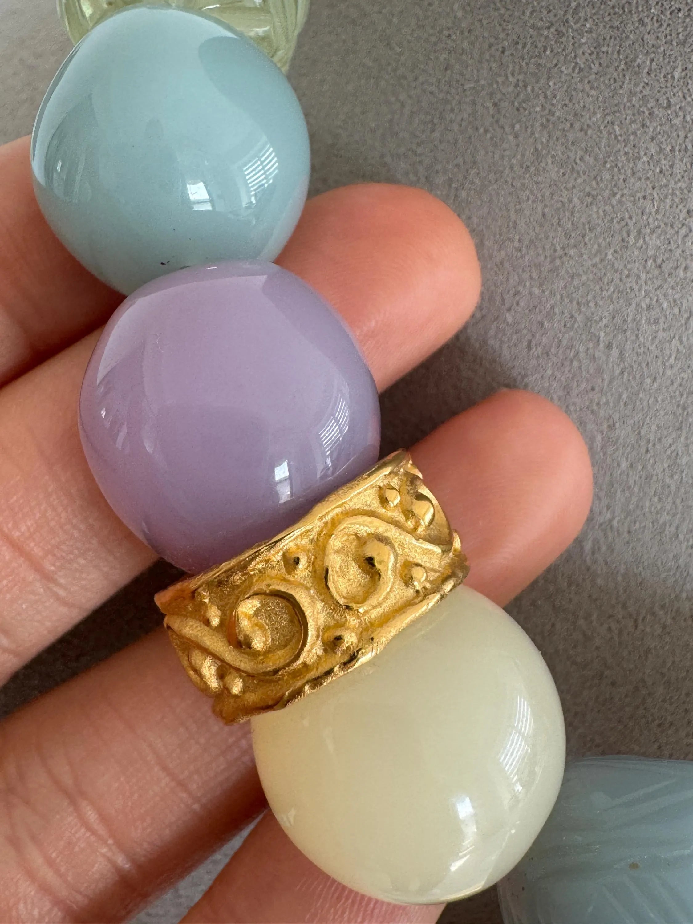 Close-up of Vintage Givenchy pastel bead gold plated choker necklace