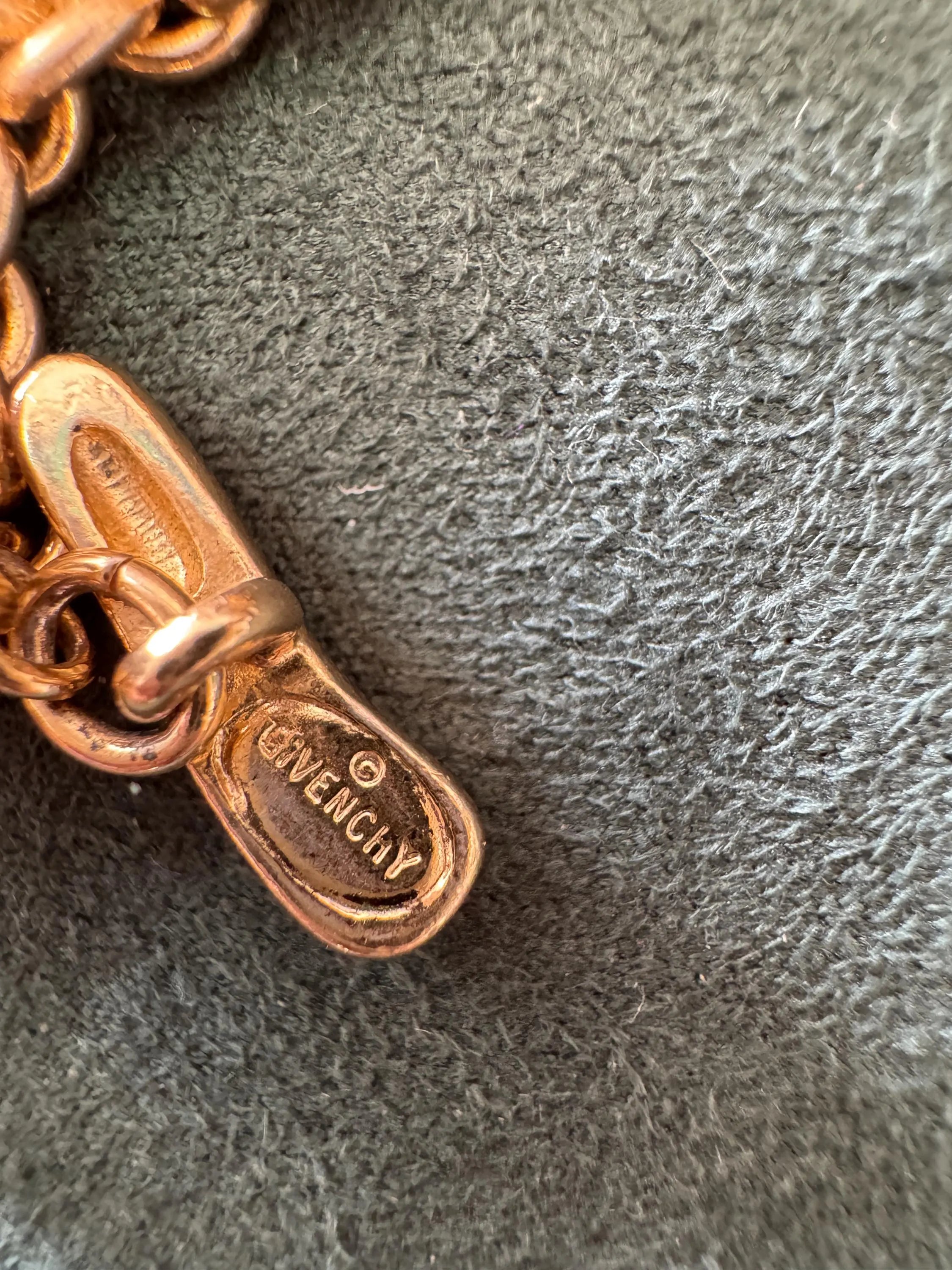 Close-up of Givenchy heart pendant on vintage Paris New York choker necklace