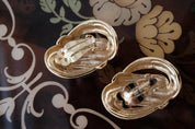 Side view of Vintage Givenchy Paris New York clip-on earrings with knot design