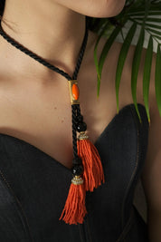 Vintage Yves Saint Laurent tassel necklace in coral and black with long chain design, classic YSL statement fashion jewelry.