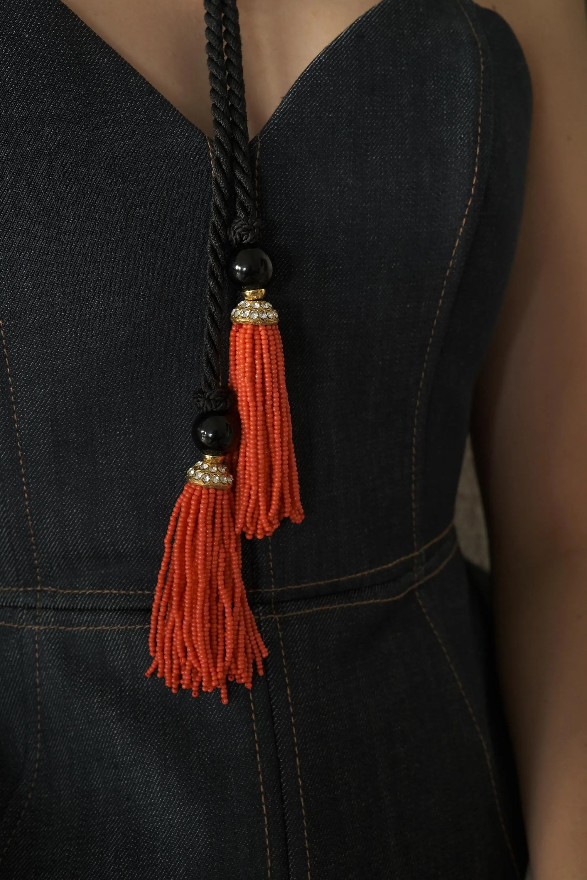 Vintage Yves Saint Laurent tassel necklace in coral and black with long chain design, classic YSL statement fashion jewelry.