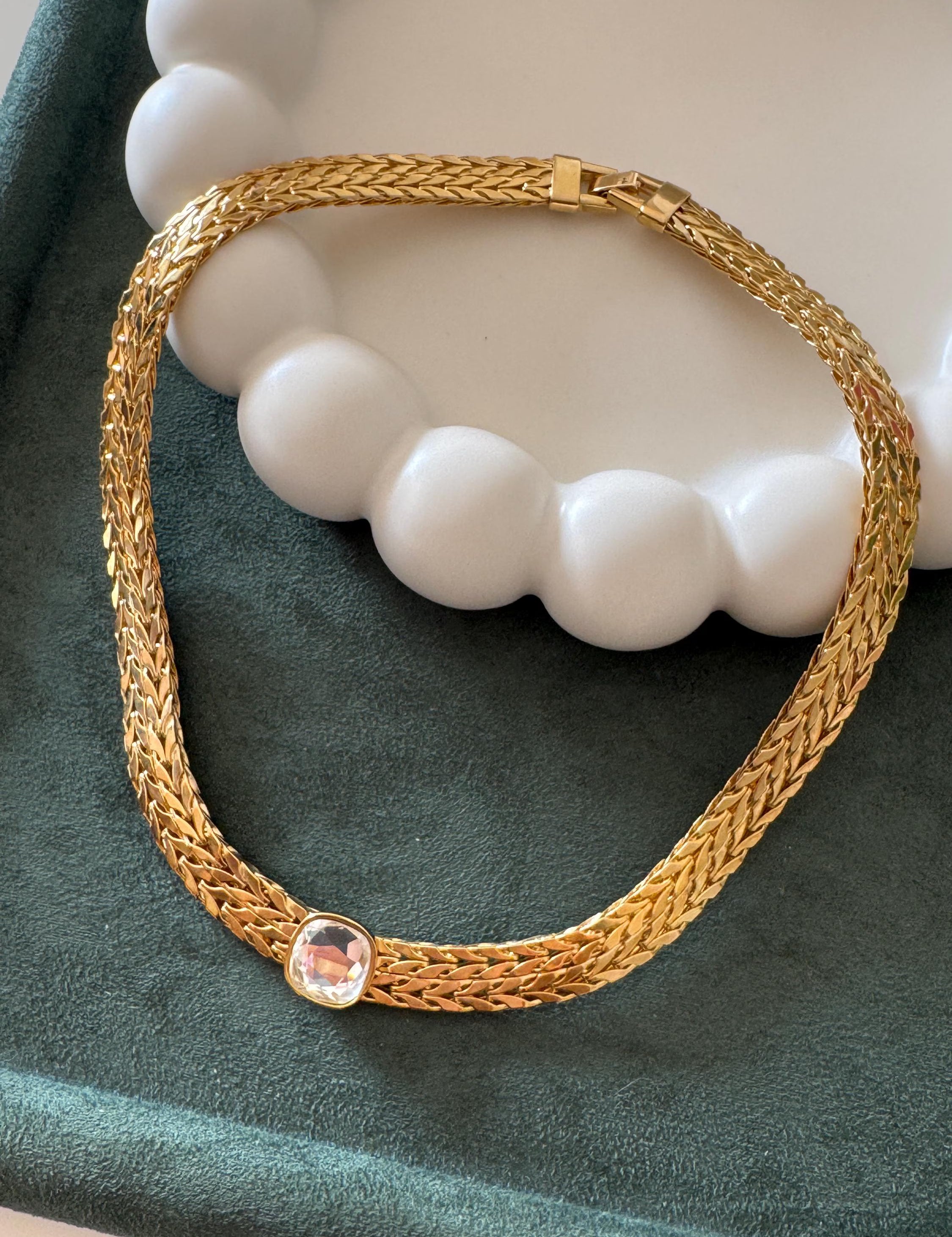 Vintage Avon gold tone choker necklace with crystal rhinestone charm, refined statement jewelry for sophisticated women