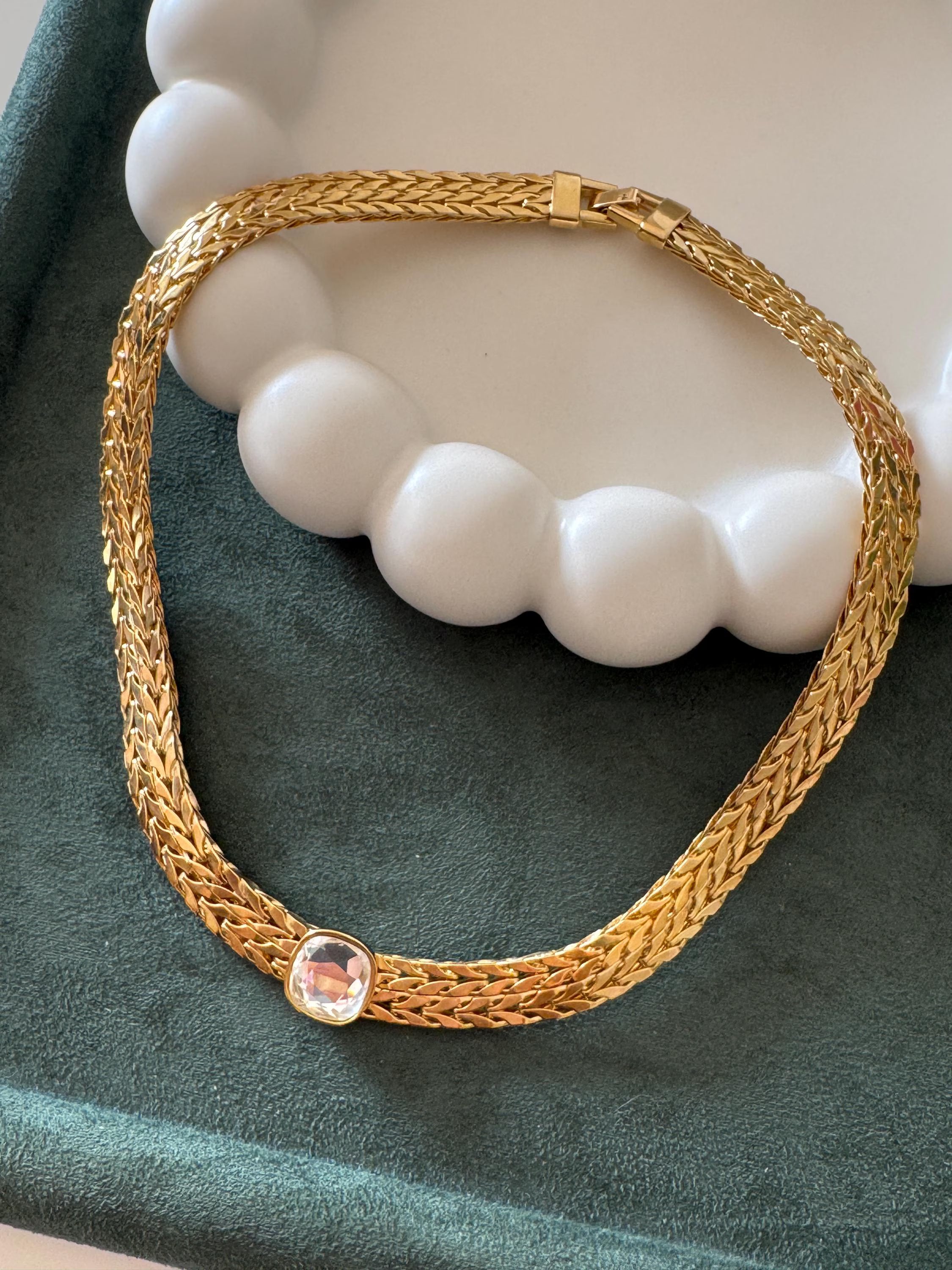 Vintage Avon gold tone choker necklace with crystal rhinestone charm, refined statement jewelry for sophisticated women