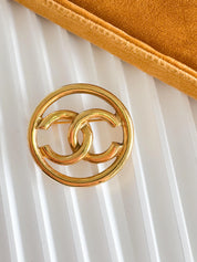 Vintage Chanel gold interlocking CC brooch, understated French luxury accessory