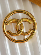 Vintage Chanel gold round CC brooch, elegant and timeless European style jewelry