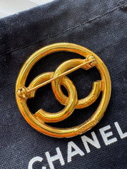 Vintage Chanel gold interlocking CC brooch, understated French luxury accessory