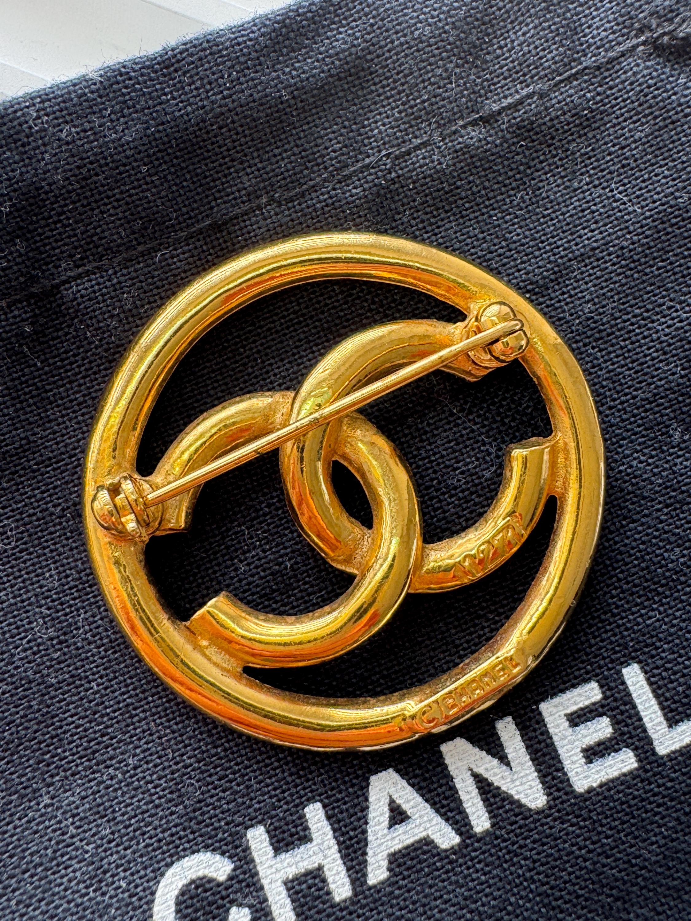 Vintage Chanel gold interlocking CC brooch, understated French luxury accessory