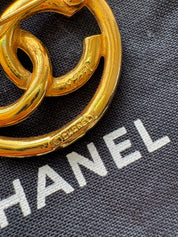 Vintage Chanel gold interlocking CC brooch, understated French luxury accessory