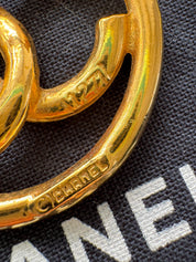 Vintage Chanel gold CC circle brooch, refined Parisian heritage jewelry with timeless elegance