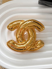 Authentic vintage Chanel gold CC logo quilted brooch, iconic French luxury statement piece