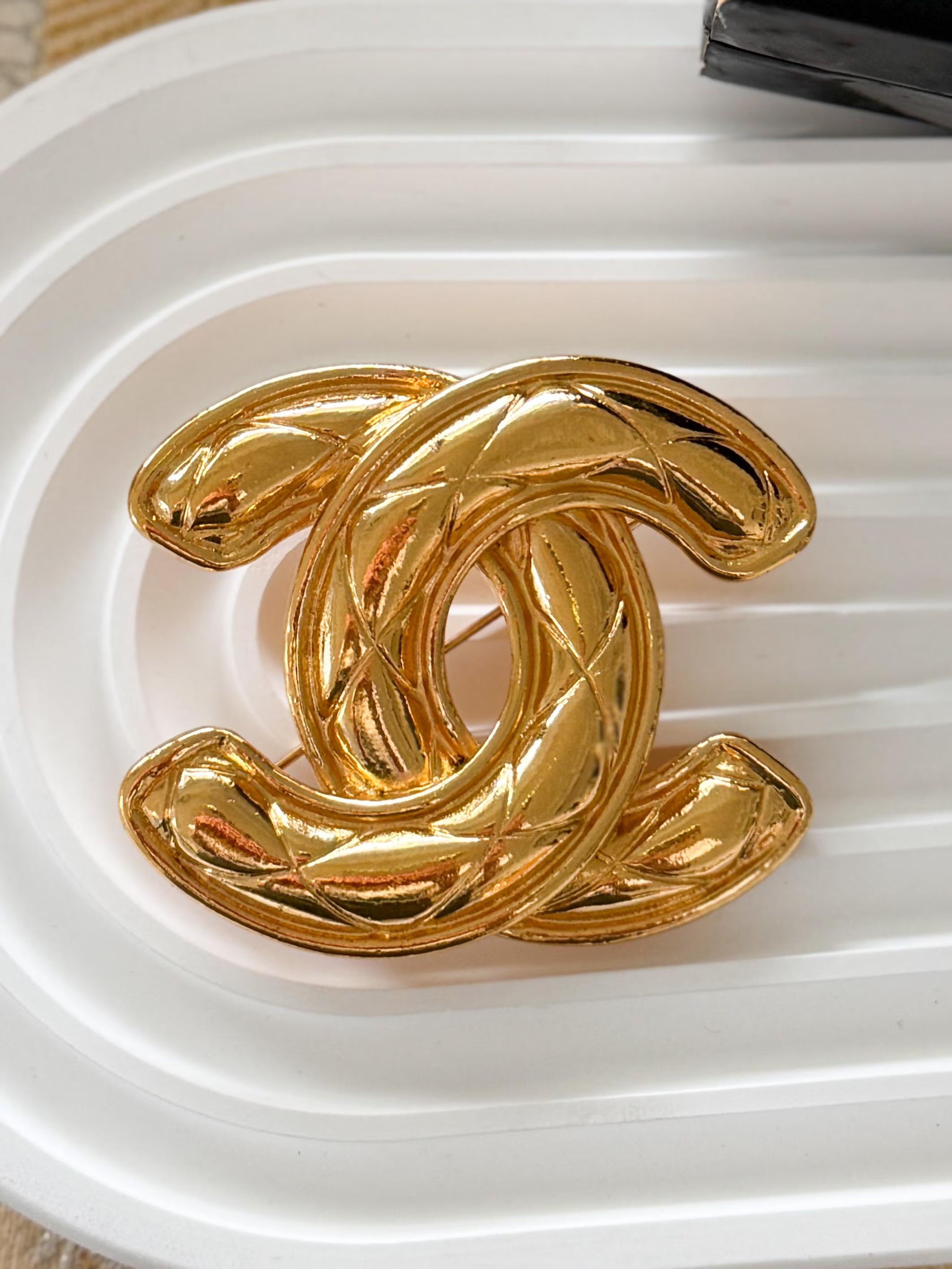 Authentic vintage Chanel gold CC logo quilted brooch, iconic French luxury statement piece
