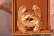 Vintage Chanel gold quilted CC brooch, elegant and timeless French designer piece